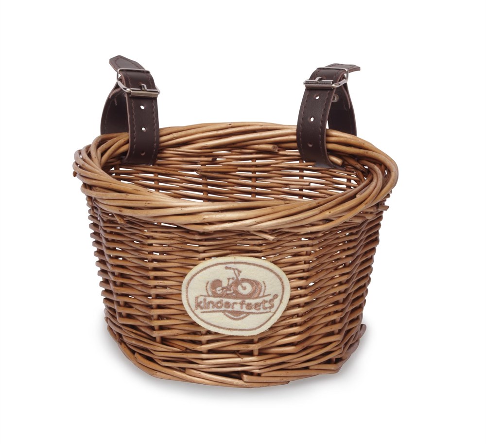 Kinderfeets wicker bicycle basket with leather straps and a beige logo patch on the front.