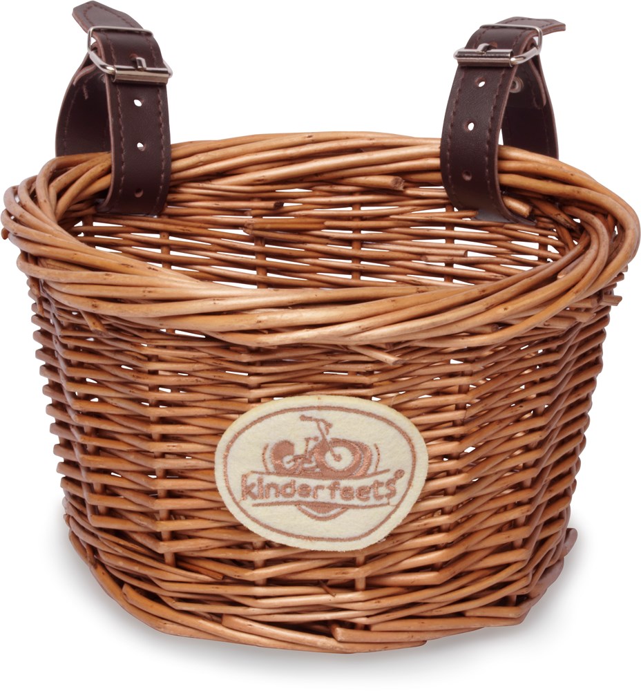 Kinderfeets wicker bicycle basket with two brown leather straps and logo on the front.